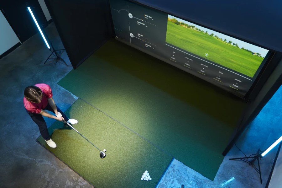 Indoor golf simulator screen showing course